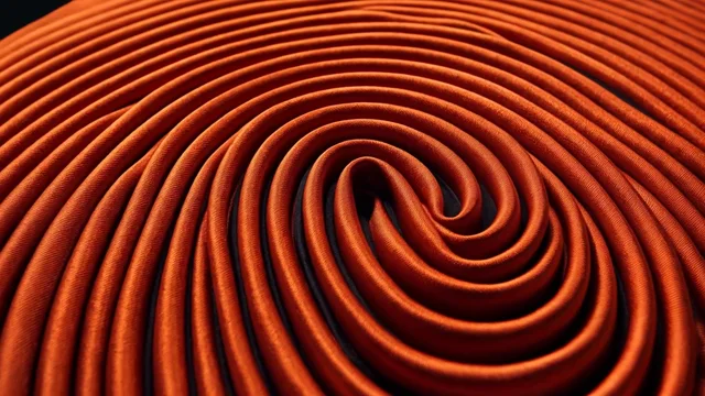 Orange satin arranged in a spiral, without text.